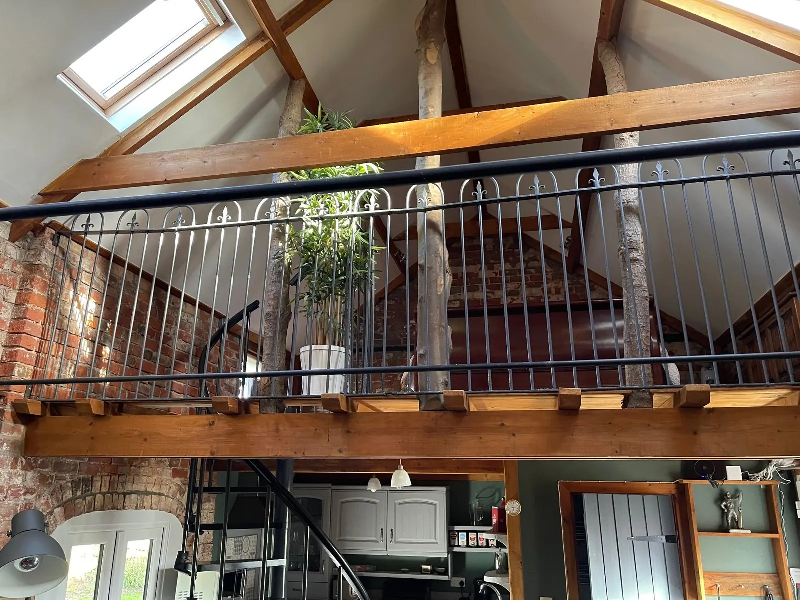 Vaulted barn interior with mezzanine bedroom
